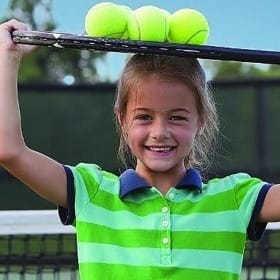 girl-with-tennis-balls-on-head-2015.jpg